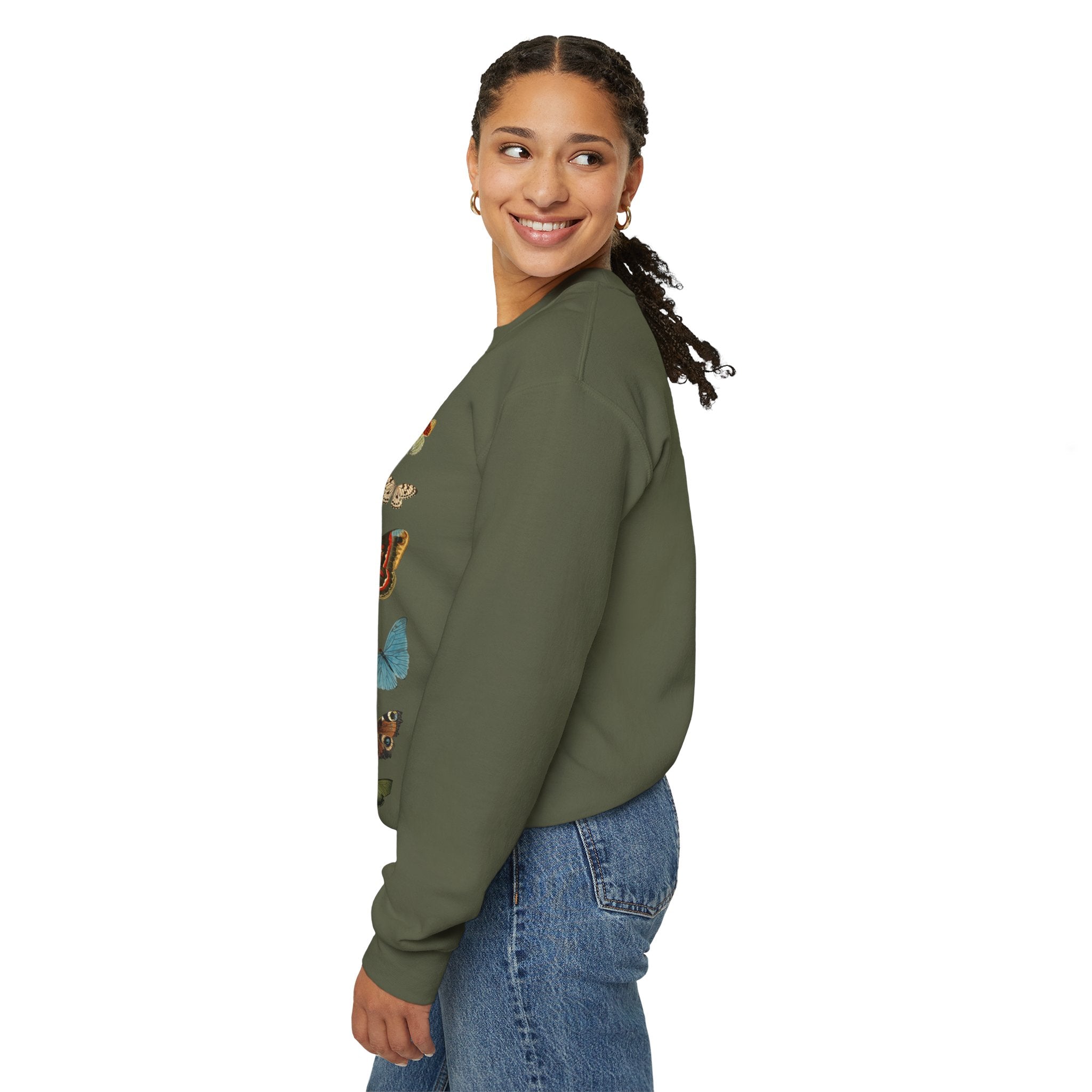 Woman wearing a Gildan military green sweatshirt with butterfly design on a white background