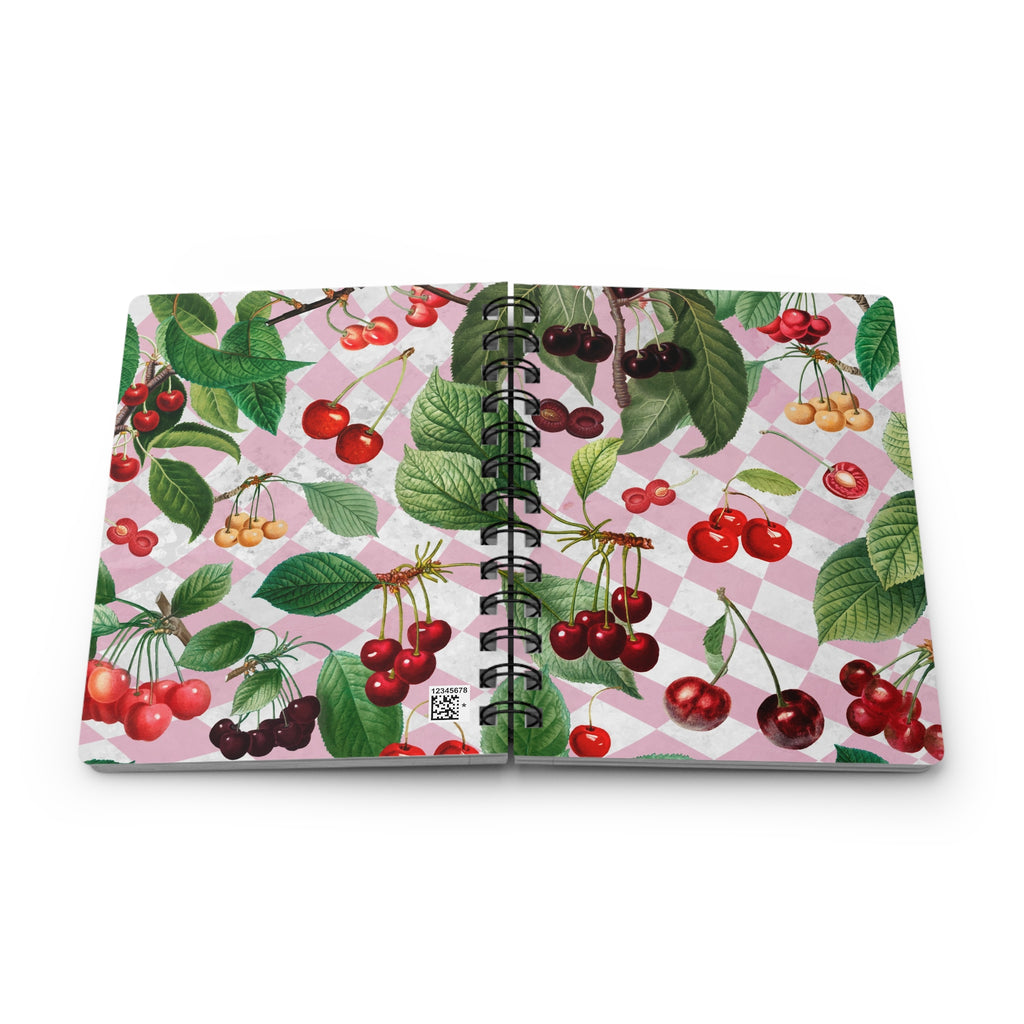 Open notebook displaying front and back cover with cherry and leaf pattern on a white background