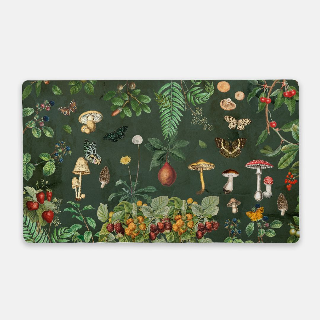 Cottagecore mushroom desk mat with vintage botanical artwork featuring forest plants, berries, butterflies, and mushrooms on a deep green background.