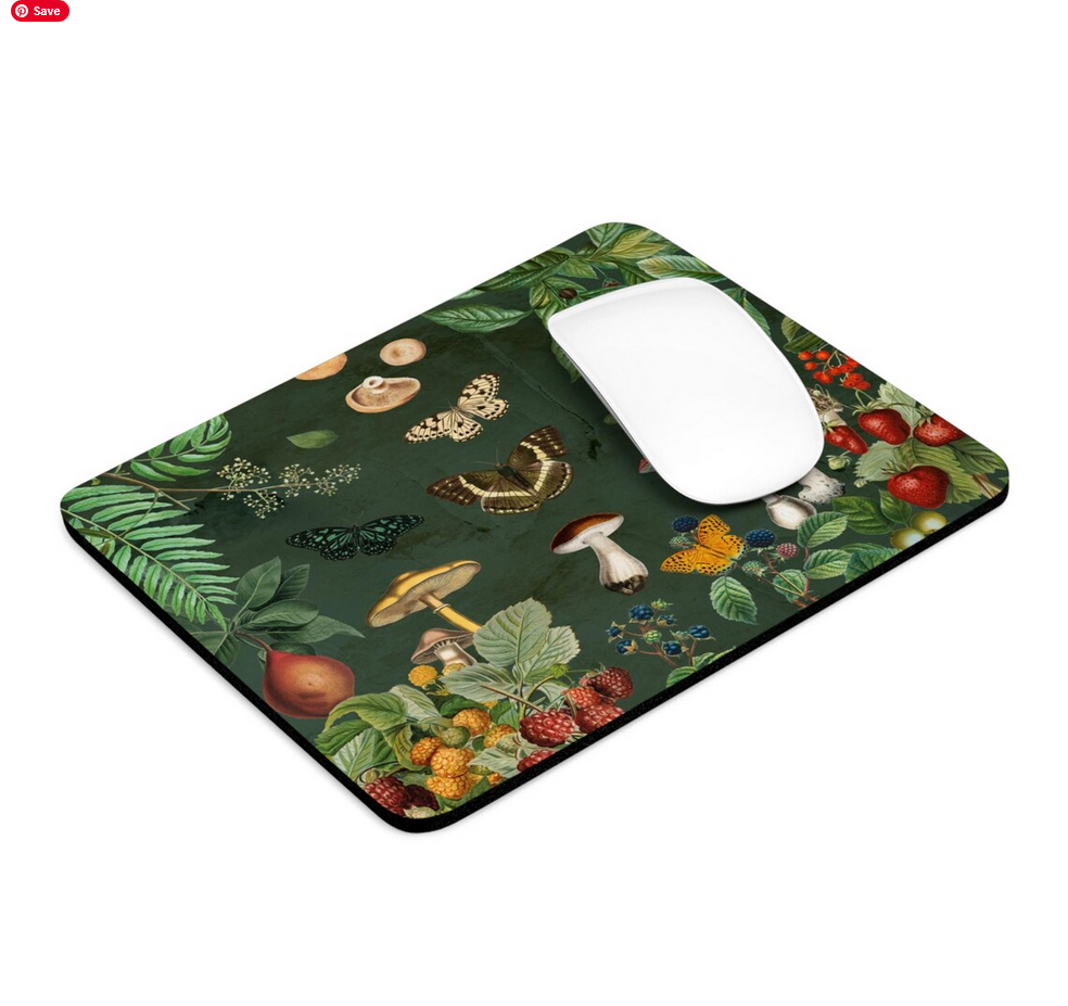 Mouse pad with nature-themed design featuring mushrooms, butterflies, and plants on a green background.
