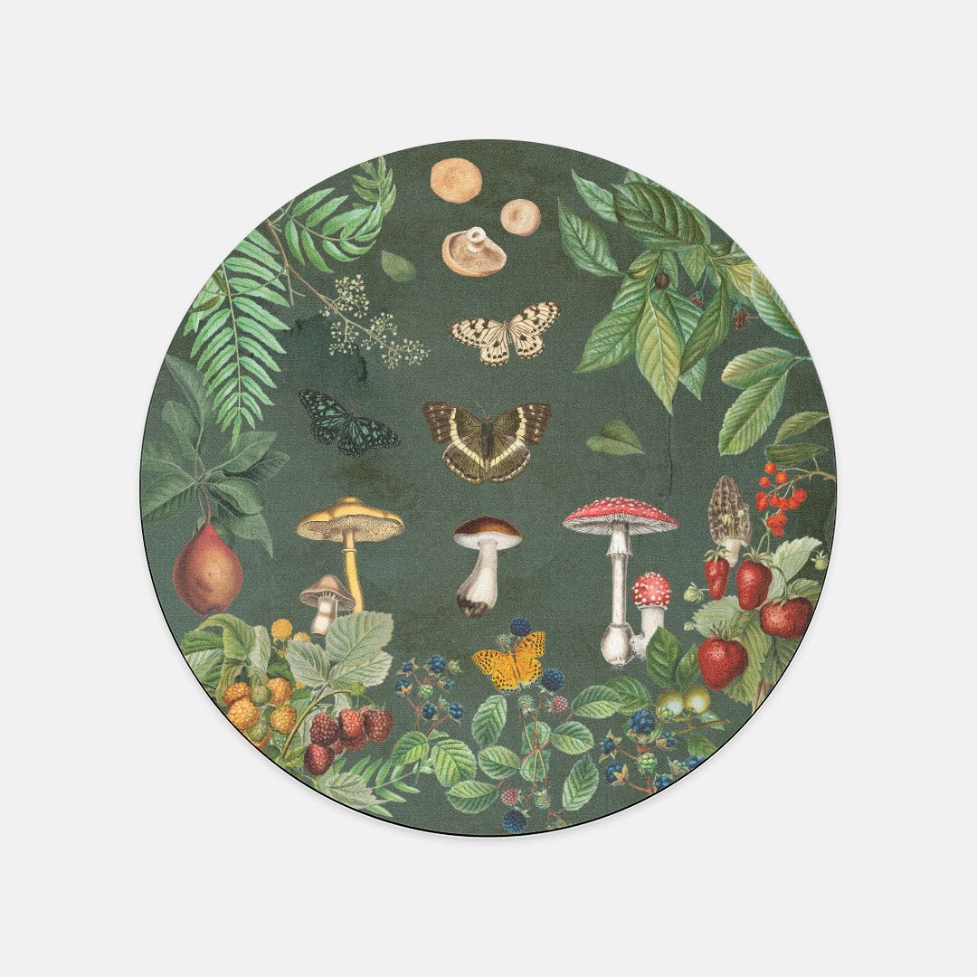 Round green mouse pad with nature-themed design featuring mushrooms, butterflies, and fruits on a white background.