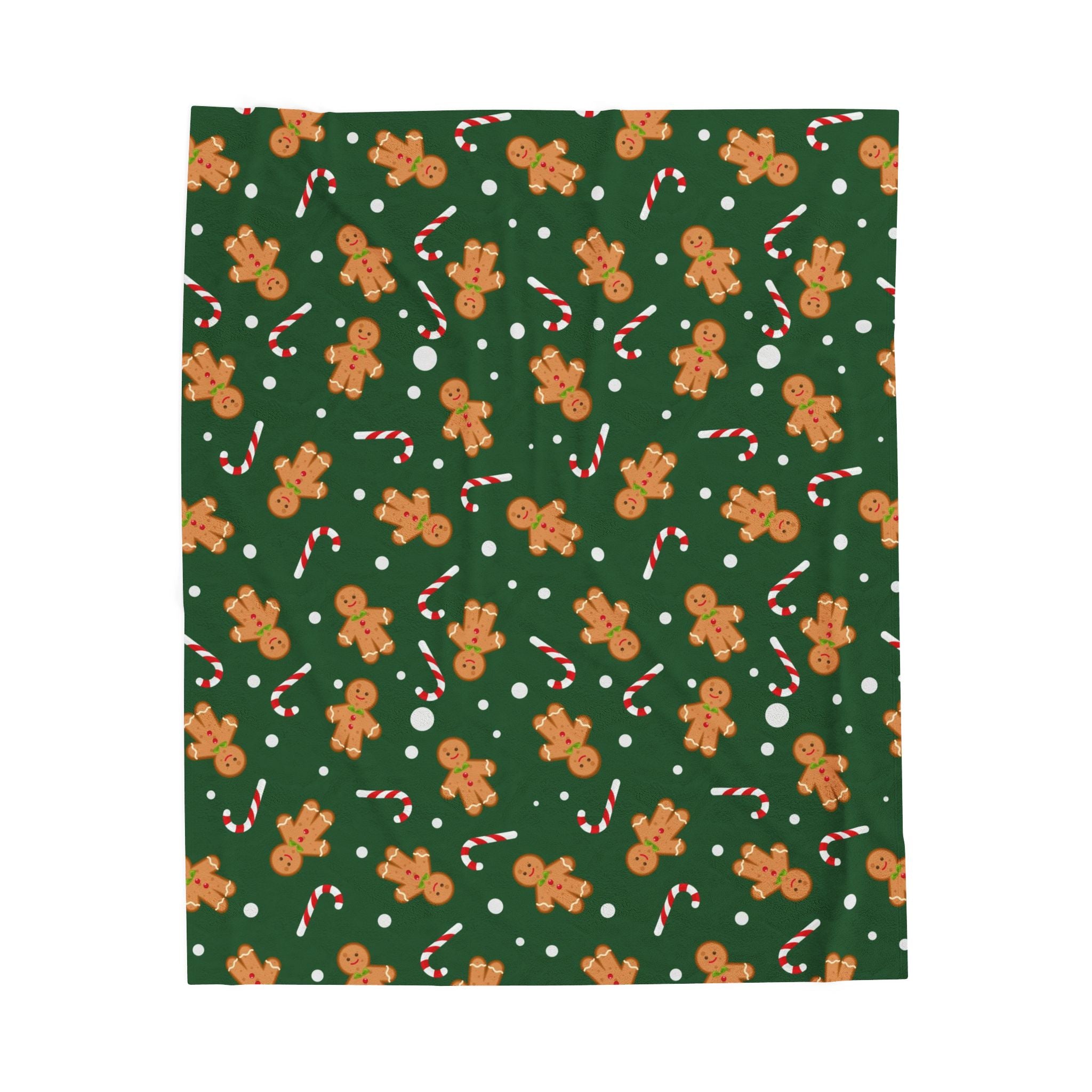 Green fabric with gingerbread man and candy cane pattern