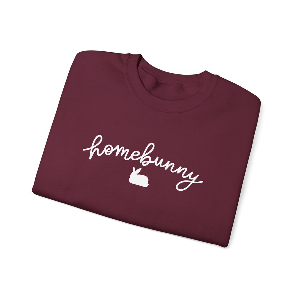 Folded maroon sweatshirt with 'homebunny' text and rabbit icon on a white background