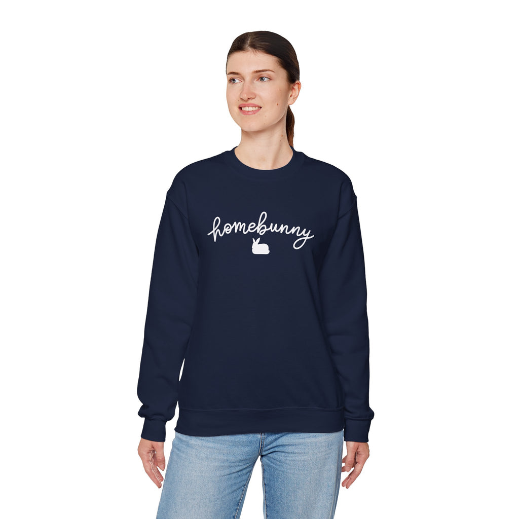 Person wearing a navy blue sweatshirt with 'homebunny' text on a white background