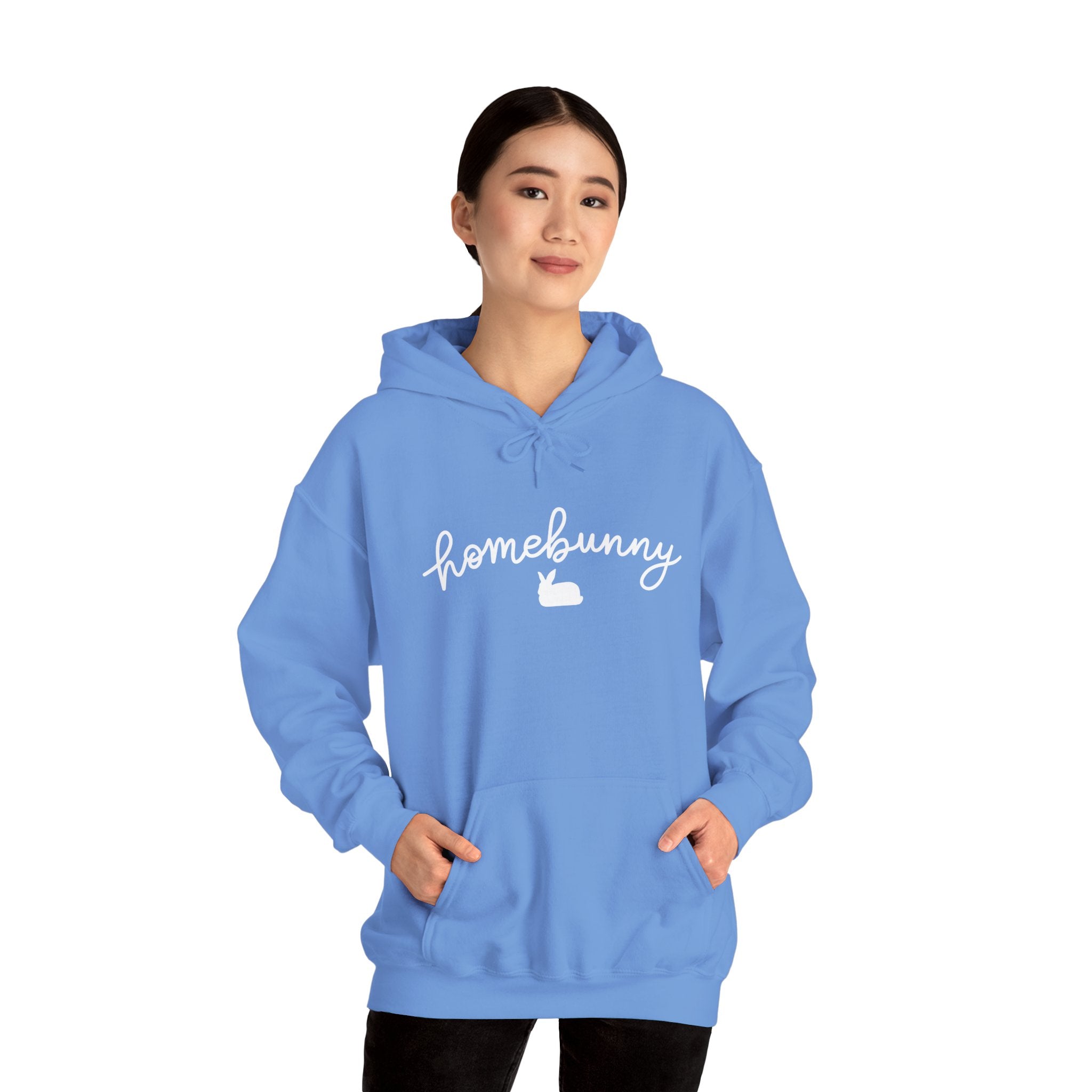 Person wearing a Carolina blue hoodie with 'homebunny' text on a white background