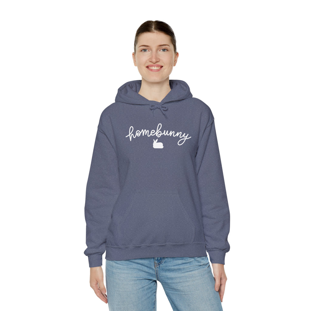 Person wearing a heather navy hoodie with 'homebunny' text on a white background
