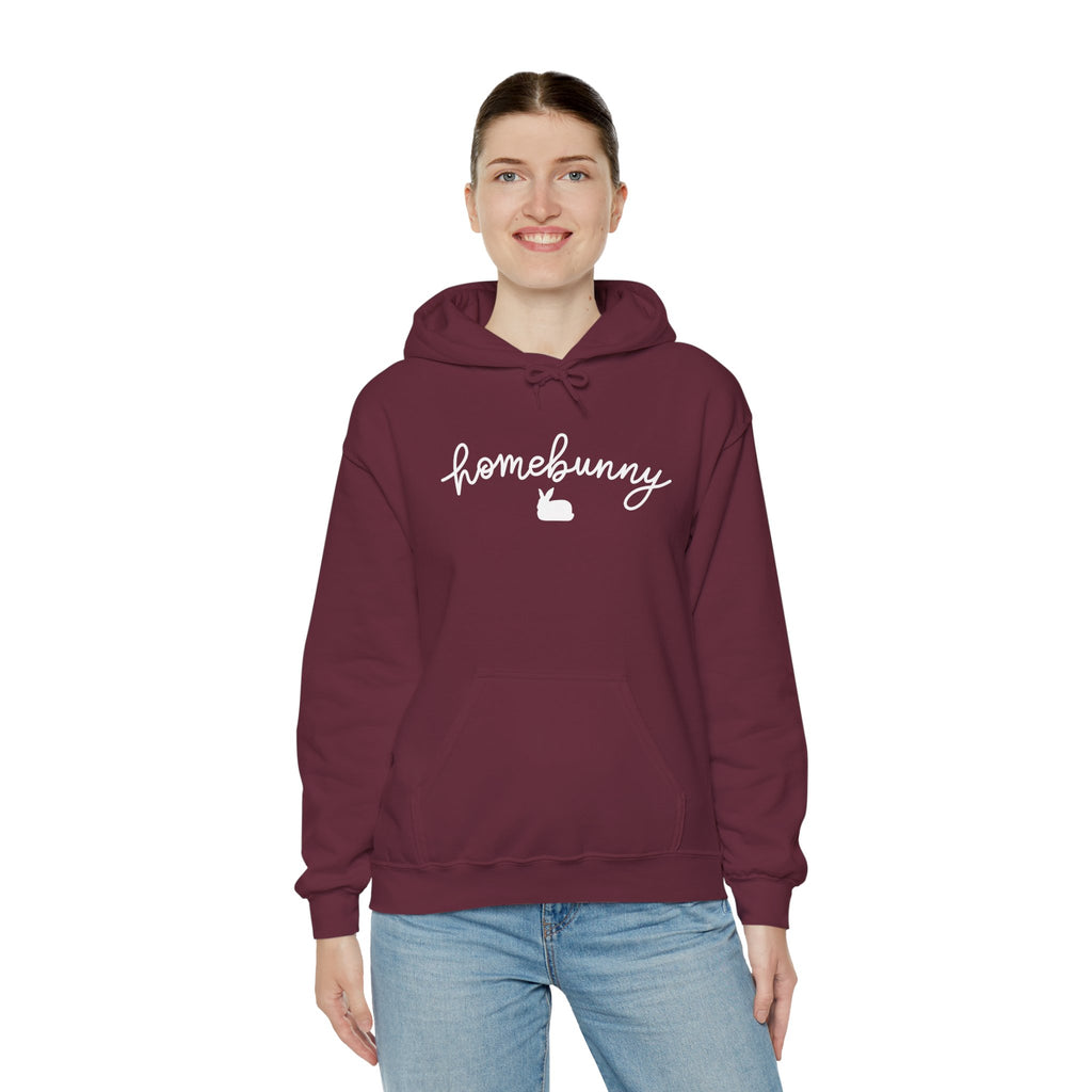 Person wearing a maroon hoodie with 'homebunny' text on a white background