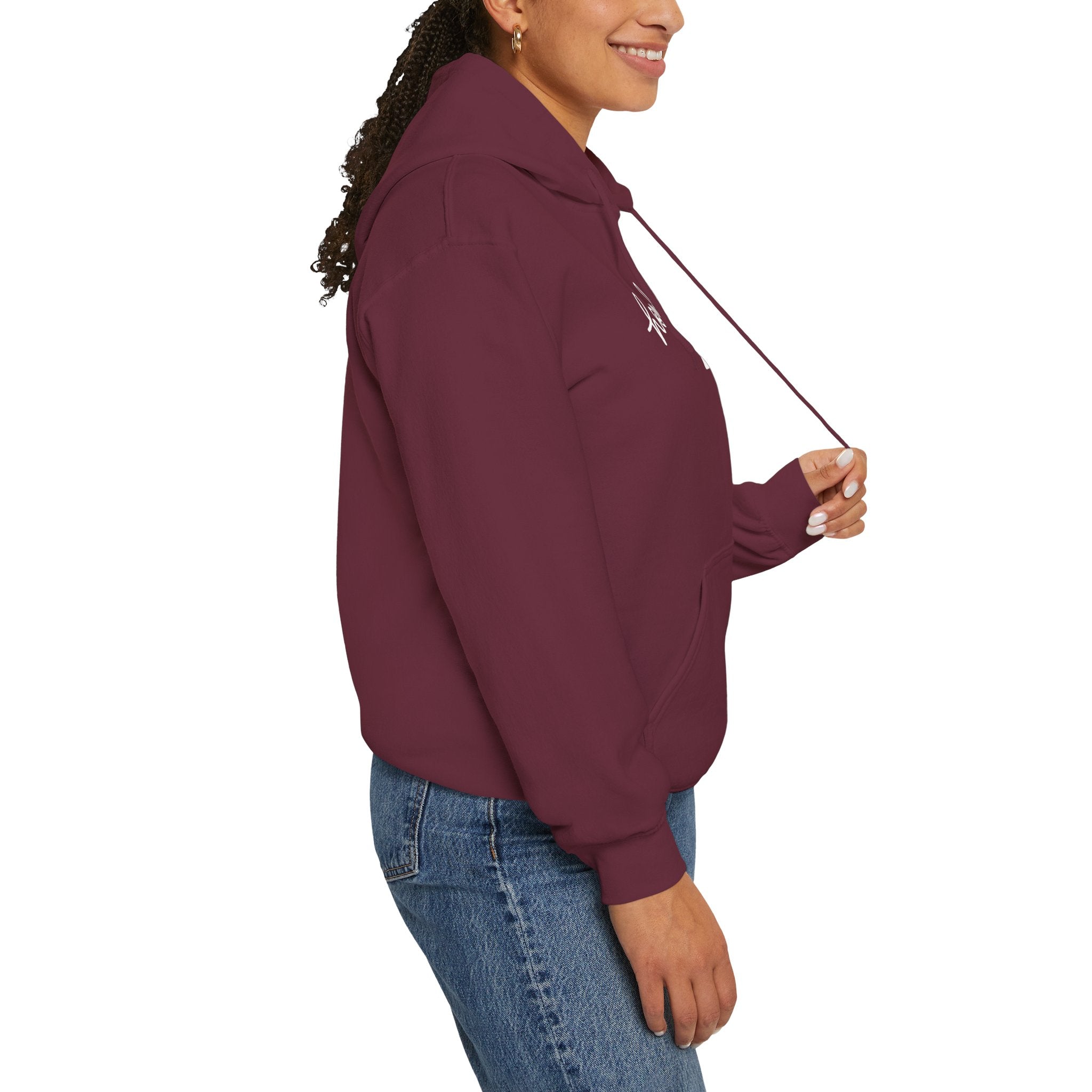 Person wearing a maroon hoodie with a logo on a white background