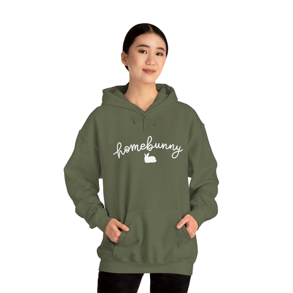 Person wearing a military green hoodie with 'homebunny' text on a white background