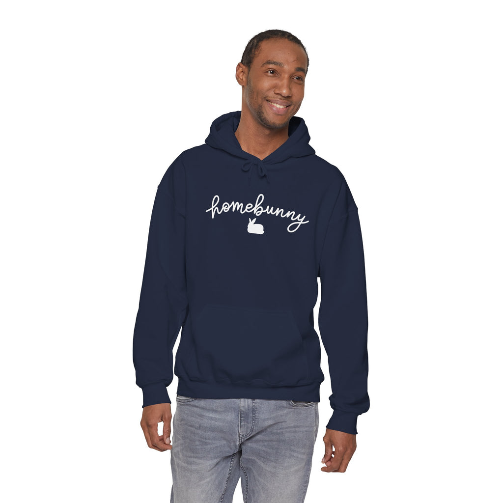 Man wearing a navy hoodie with 'homebunny' text on a white background