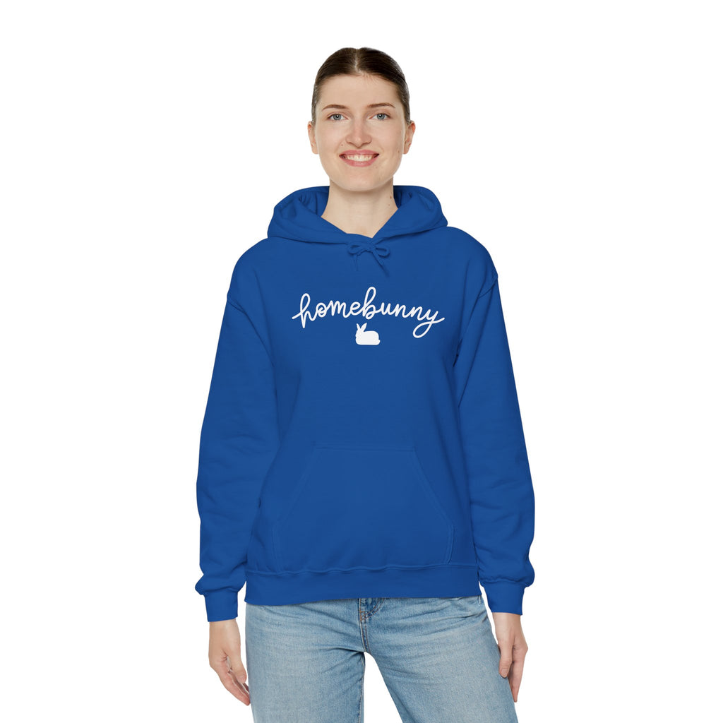 Person wearing a royal blue hoodie with 'homebunny' text on a white background