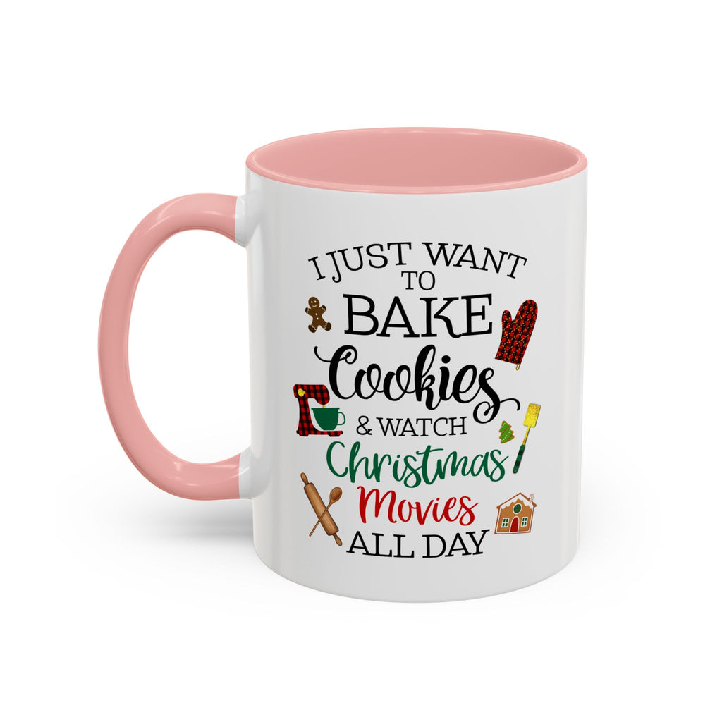 White 11 oz ceramic mug with pink interior and handle featuring a festive Christmas quote about baking cookies and watching Christmas movies.