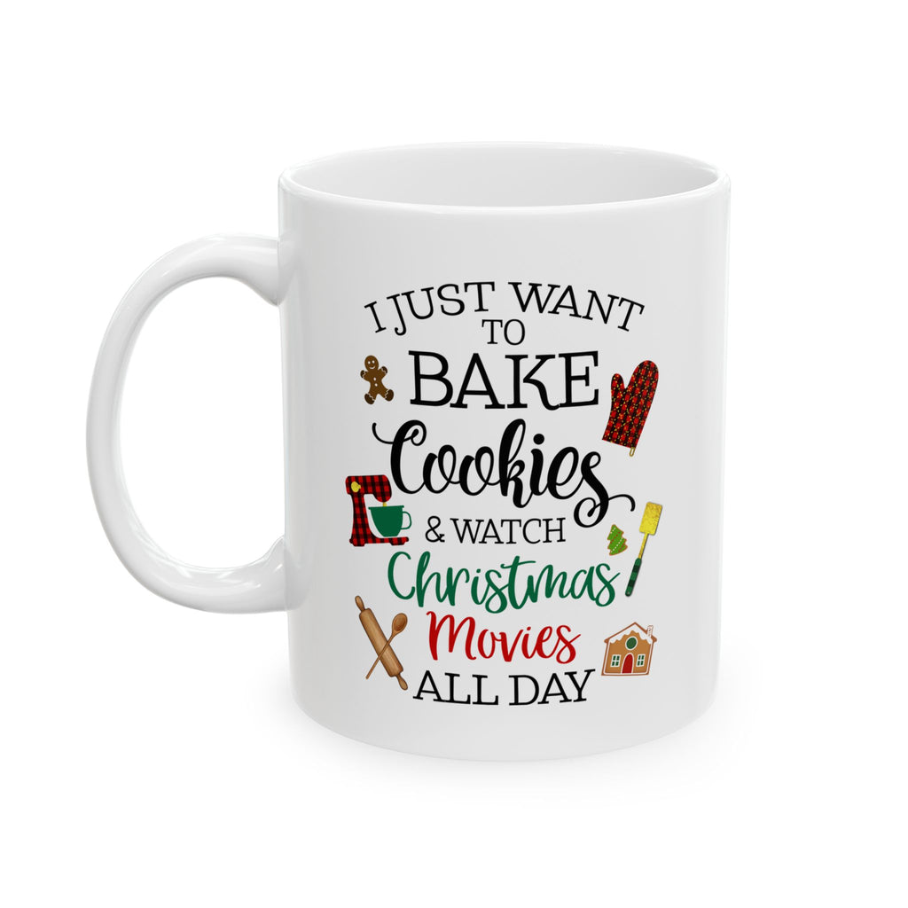 White ceramic mug with festive Christmas design and the phrase “I just want to bake cookies & watch Christmas movies all day,” featuring gingerbread, oven mitt, rolling pin, and holiday icons.