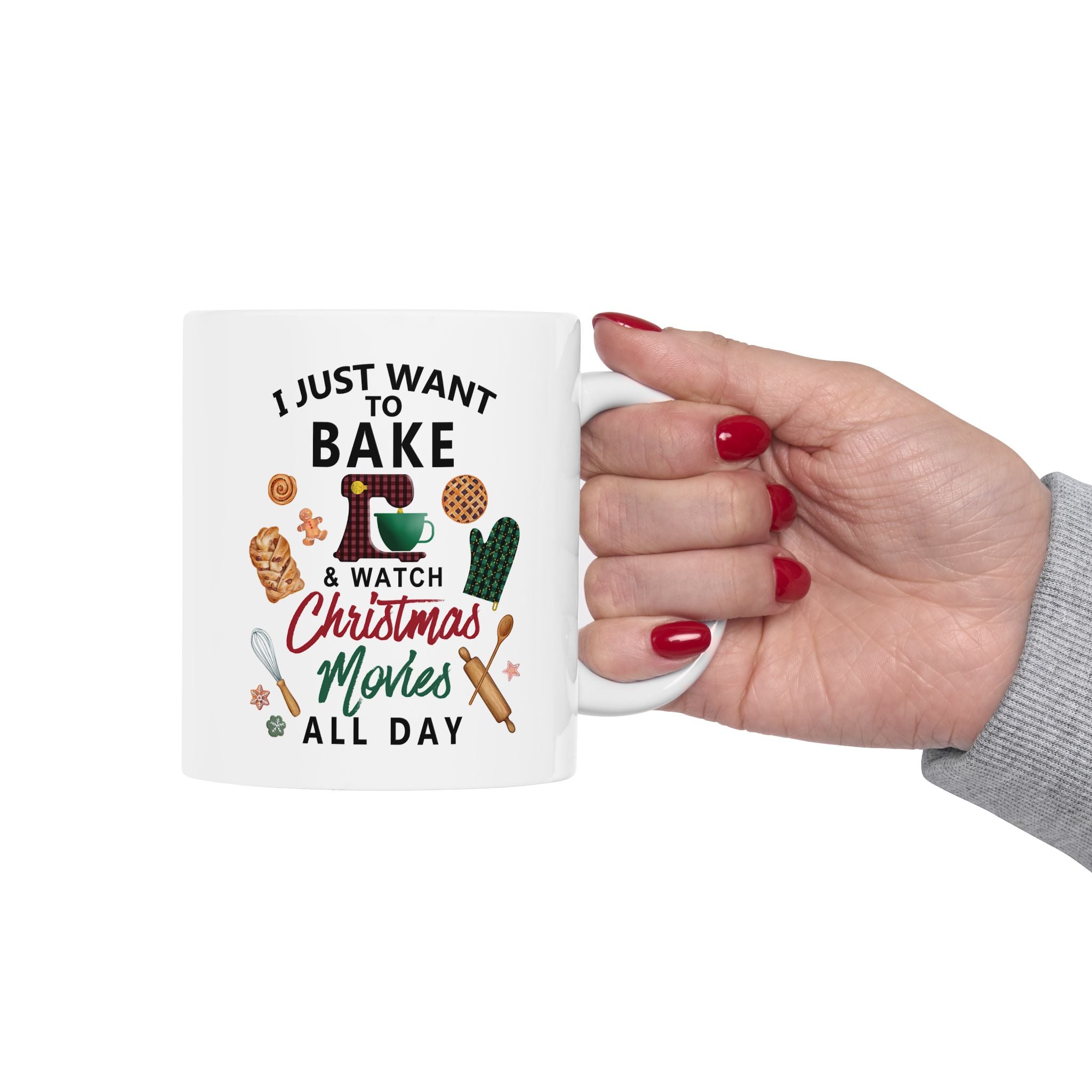 Mug with text 'I Just Want to Bake & Watch Christmas Movies All Day' held by a hand.