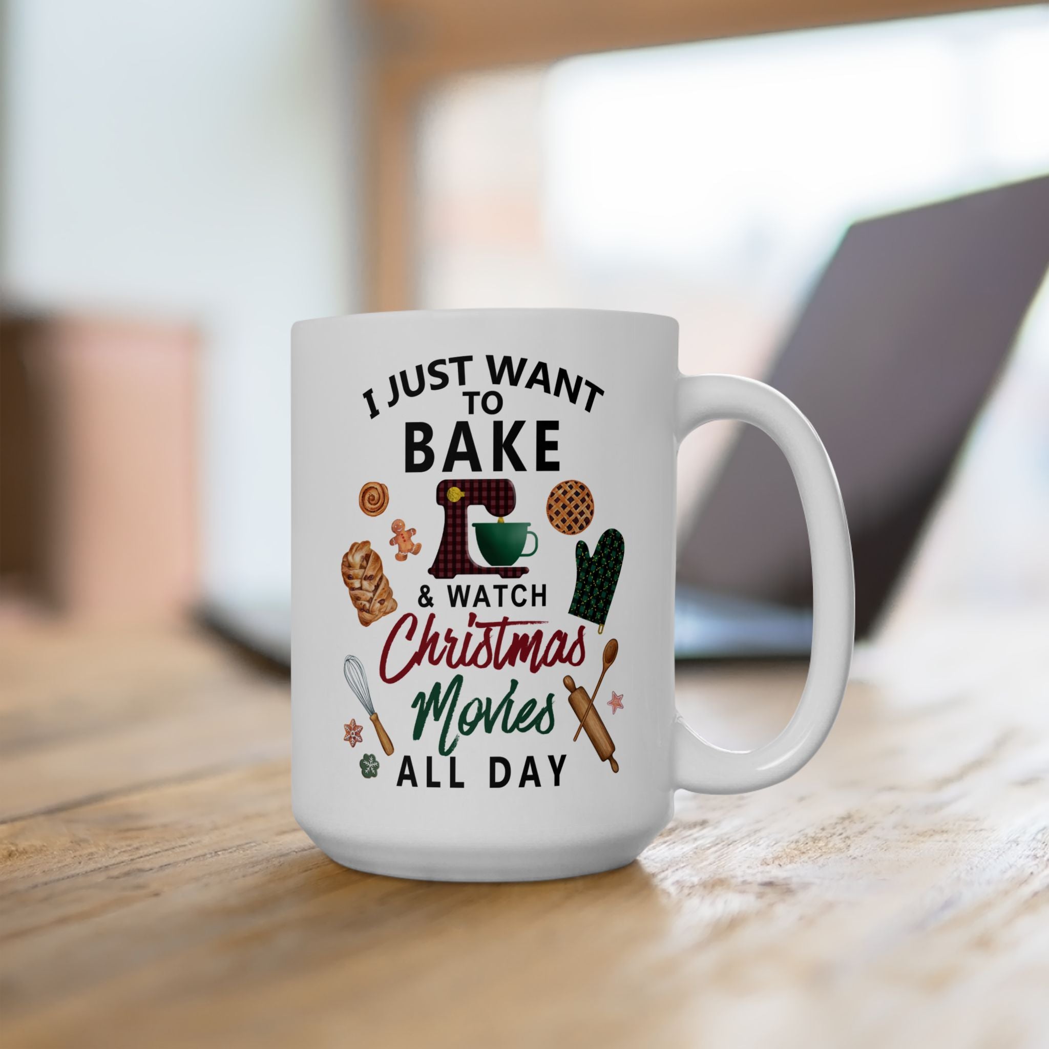 White mug with text and graphics on a wooden surface. Christmas Baking & Movie Mug, White Ceramic Holiday Cup