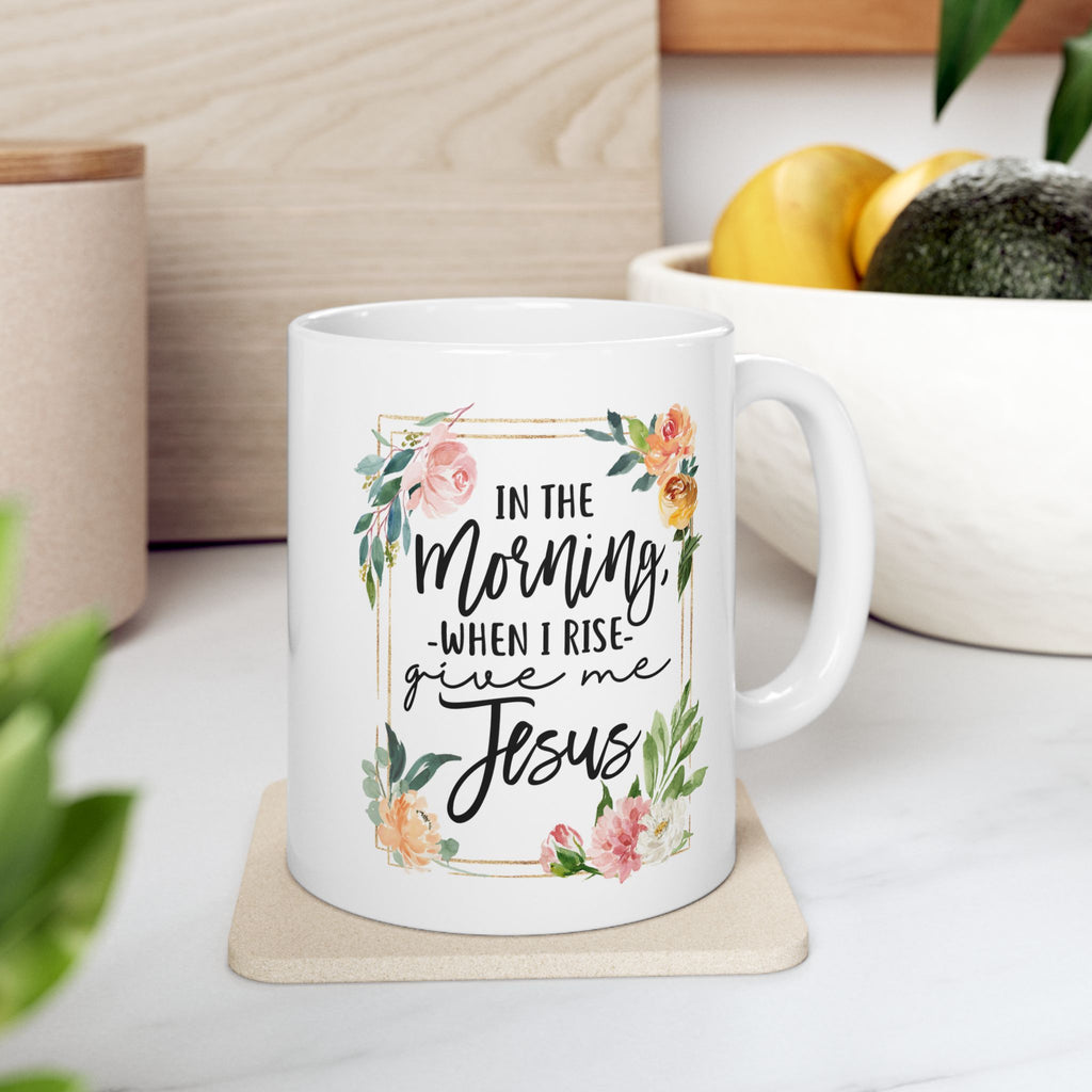 White 11 oz mug with floral design and text on a wooden surface, religious gift for women