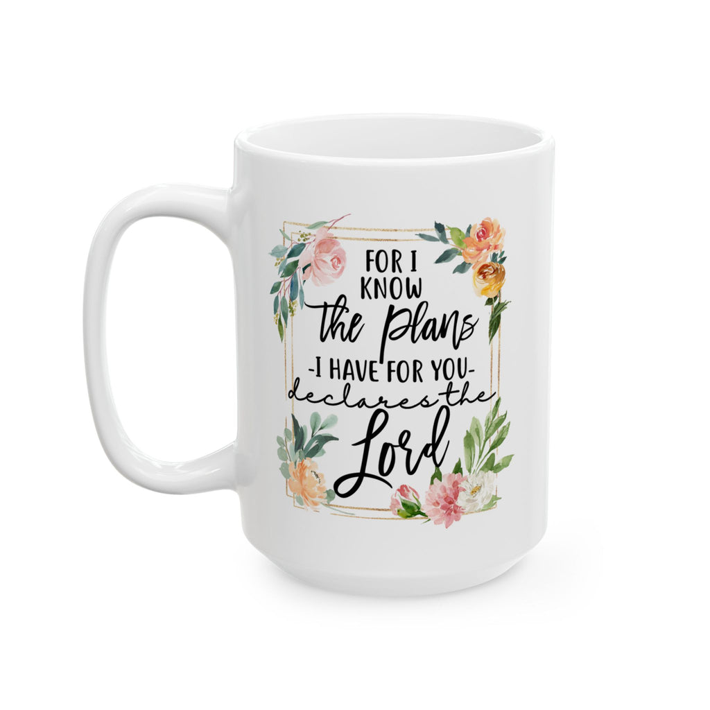 White mug with floral design and Christian bible quote on a white background