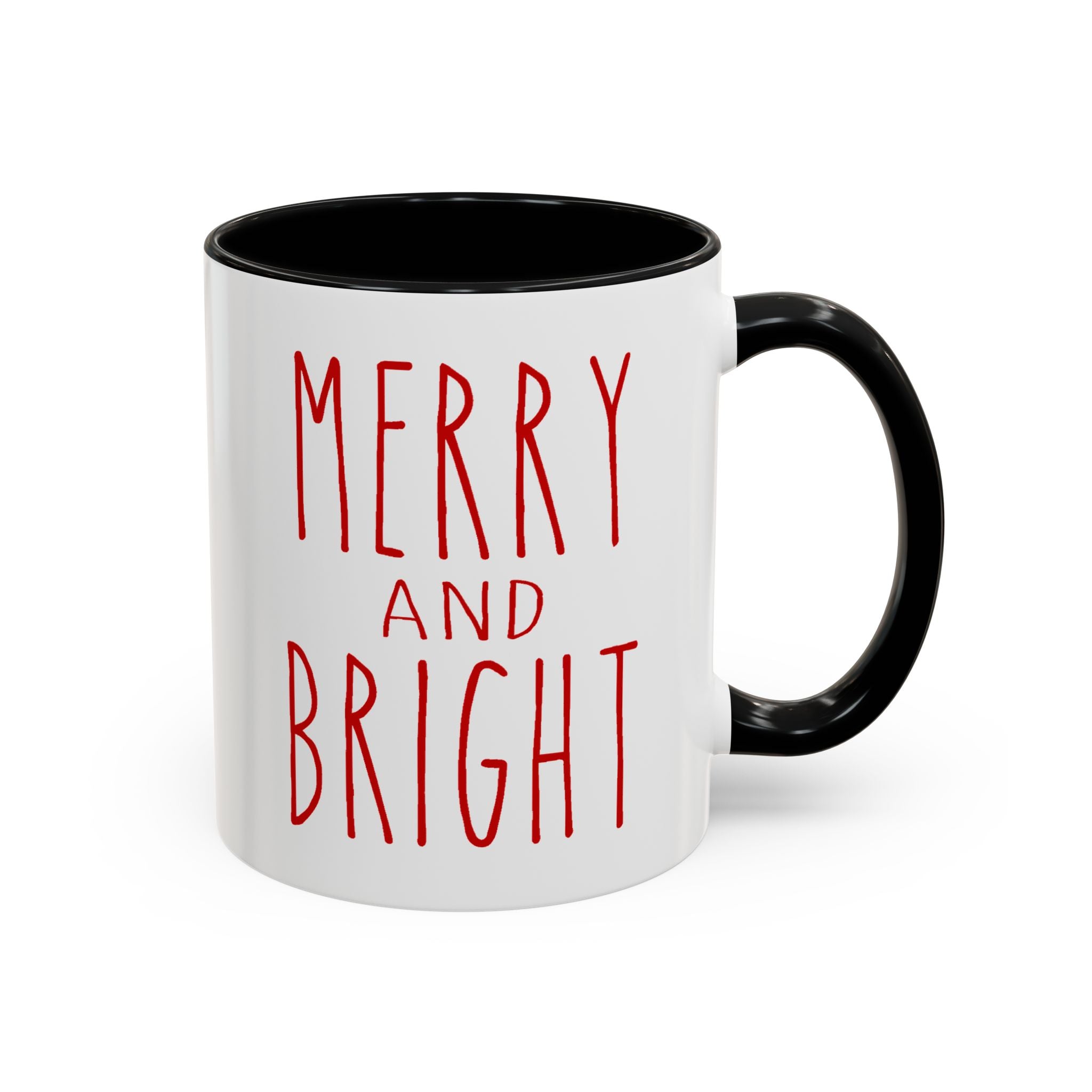 White mug with black interior and handle, featuring red text 'MERRY AND BRIGHT' on a white background.