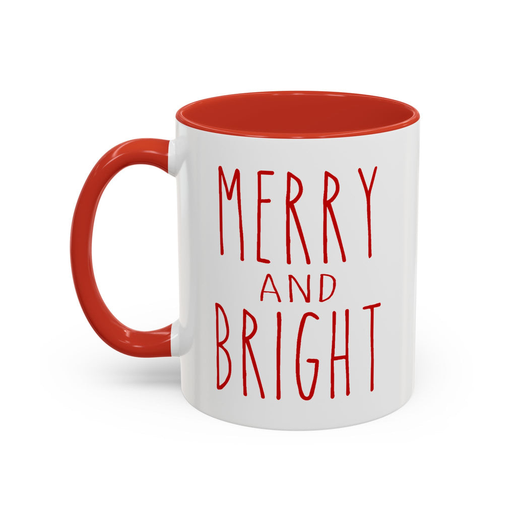 White mug with red interior and handle, featuring 'Merry and Bright' text on a white background