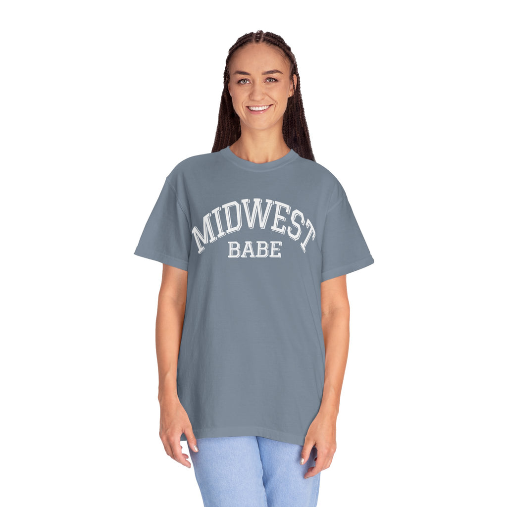 Person wearing a Comfort Colors Blue Jean t-shirt with 'MIDWEST BABE' text on a white background