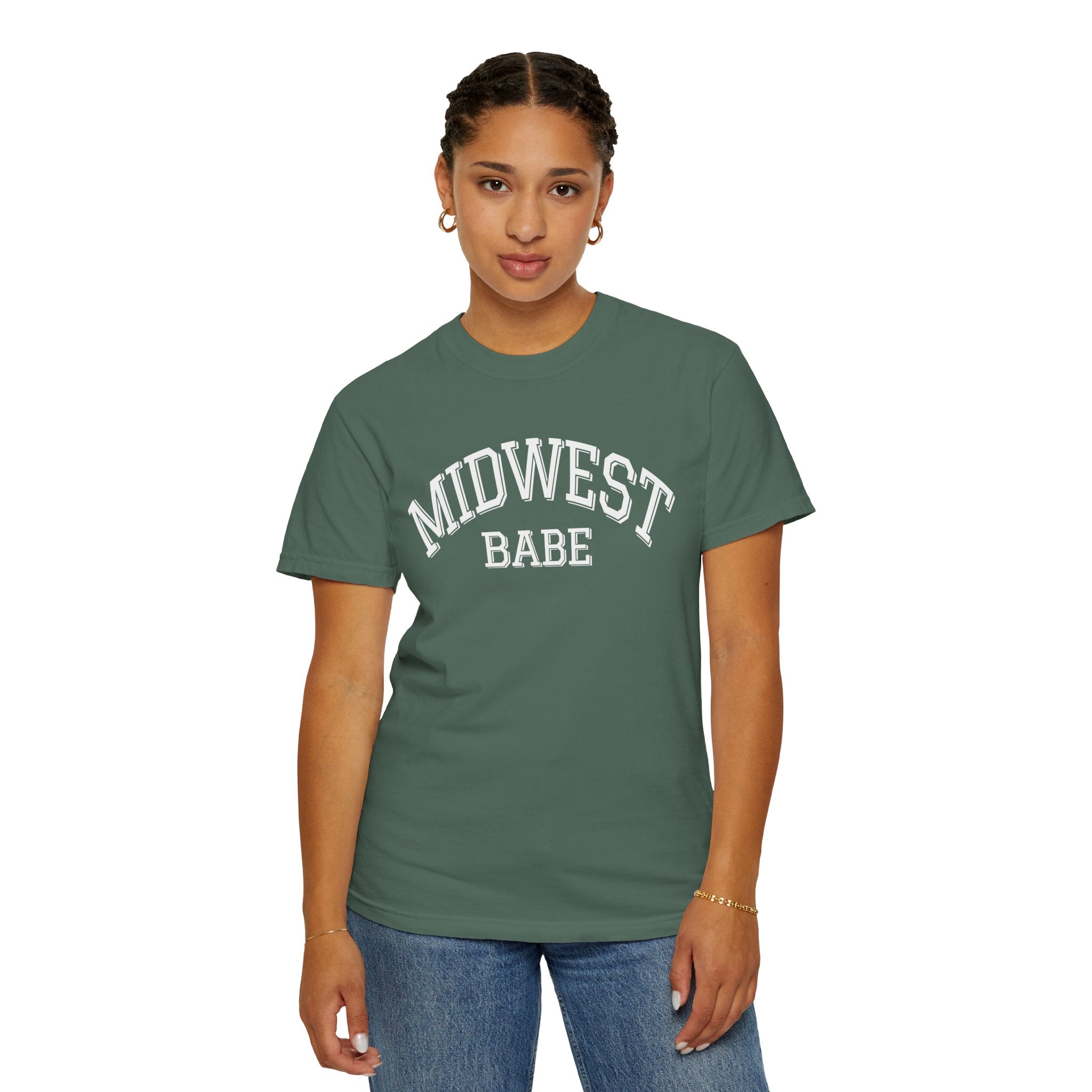 Person wearing a green Comfort Colors t-shirt in Blue Spruce with 'MIDWEST BABE' text on a white background