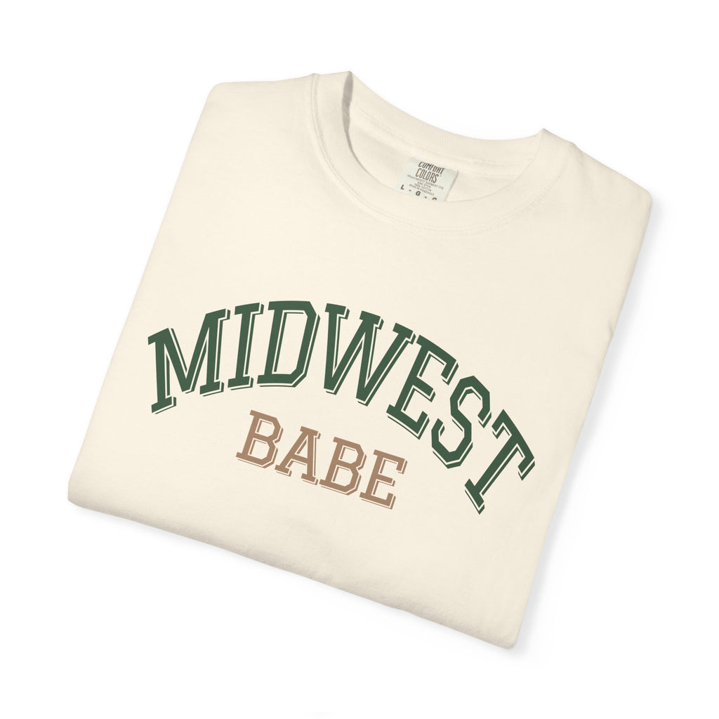 Folded Ivory t-shirt with 'Midwest Babe' text on a white background
