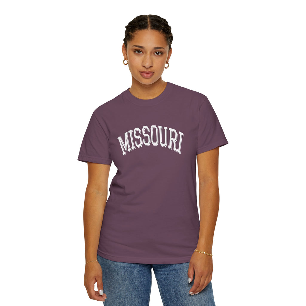 Person wearing a Comfort Colors Tee with 'MISSOURI' text on Berry t-shirt on a white background