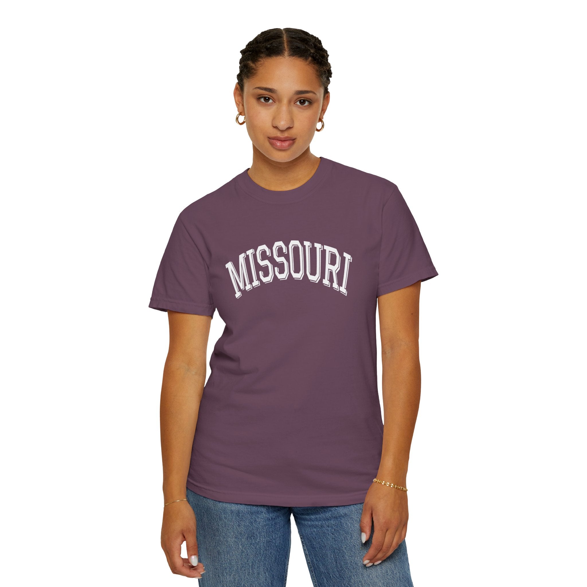 Person wearing a Comfort Colors Tee with 'MISSOURI' text on Berry t-shirt on a white background