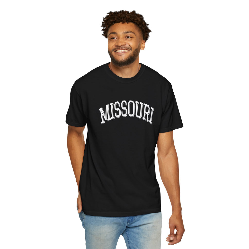 Man wearing a black t-shirt with 'MISSOURI' printed on it against a white background