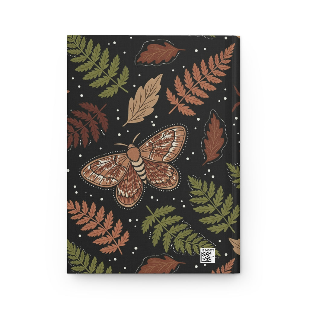 Back journal cover with a moth and leaf design on a black background