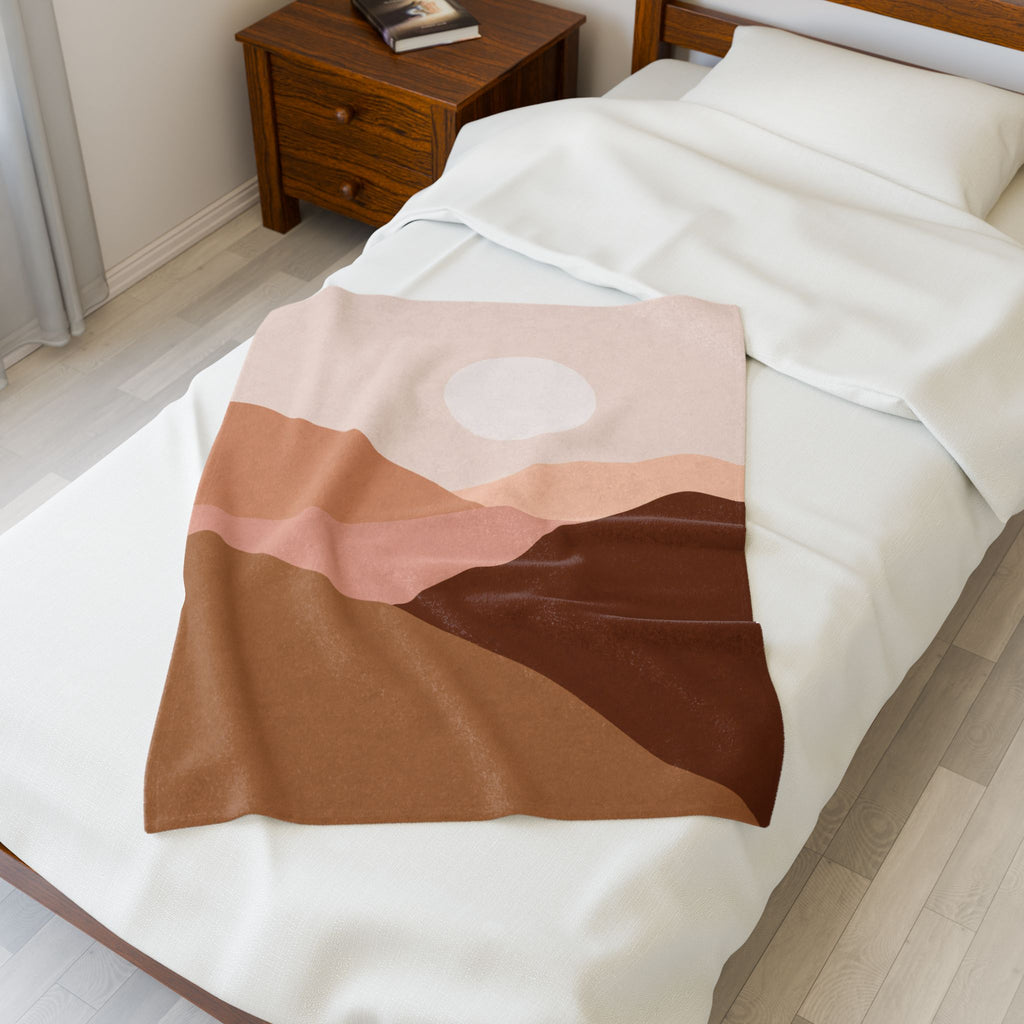 Abstract desert patterned blanket draped over a bed in a bedroom setting, Warm colored throw blanket, 30x40 inch