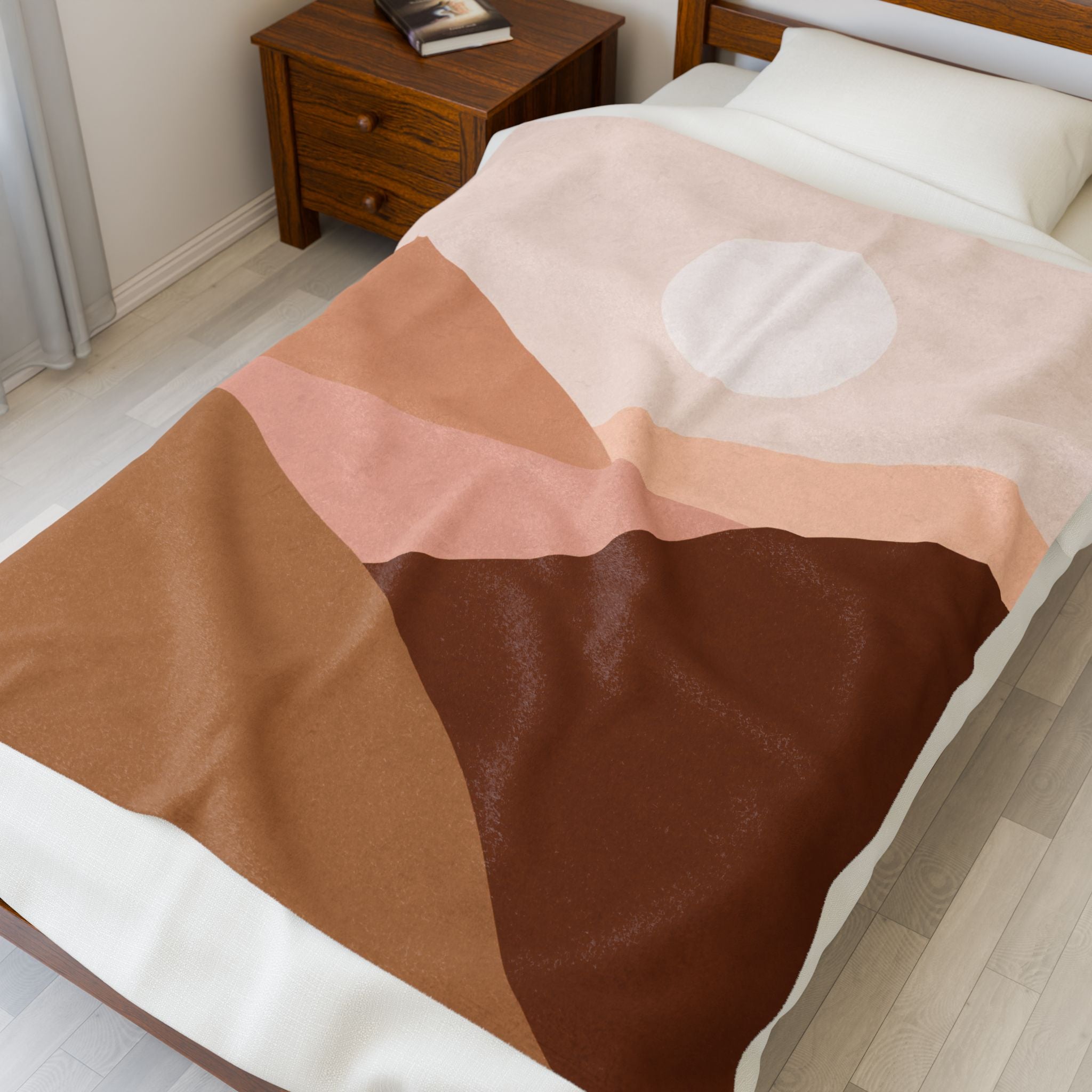 Bed with a brown and beige abstract desert print throw blanked blanket, 50x60 inch
