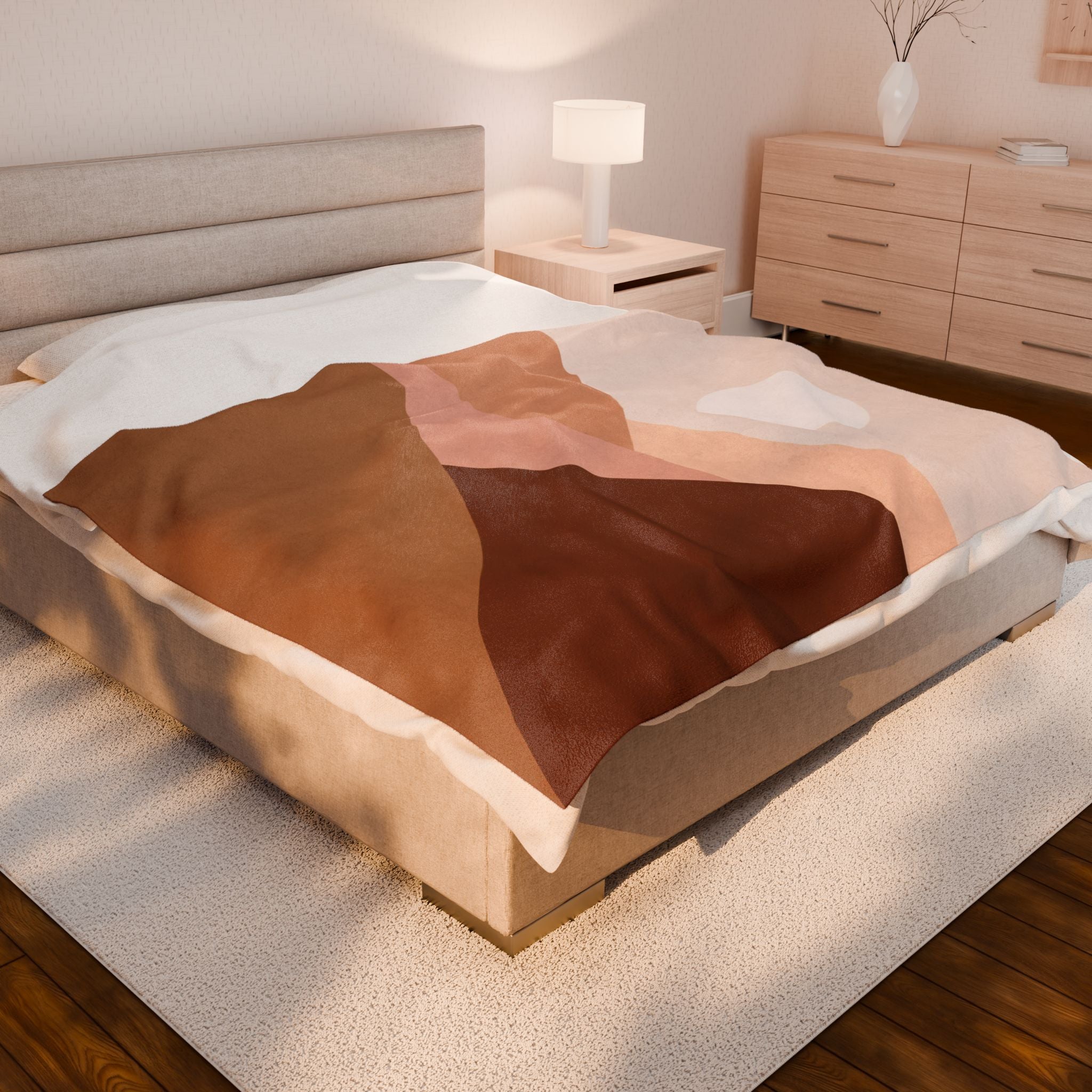 Bed with a brown and pink blanket in a bedroom setting