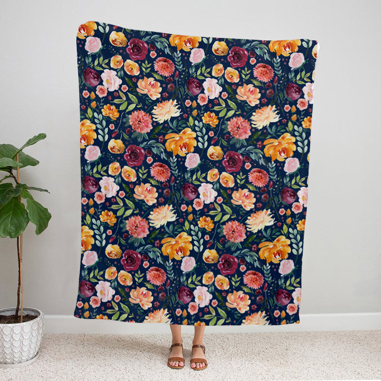 Navy with Watercolor Flowers Velveteen Plush Floral Blanket being held up by a person. 50x60 inch. floral home décor blanket