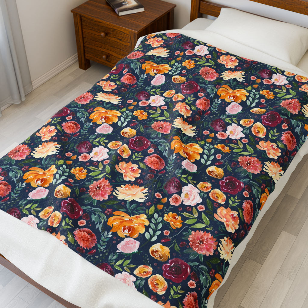 Floral patterned comforter on a bed in a bedroom setting