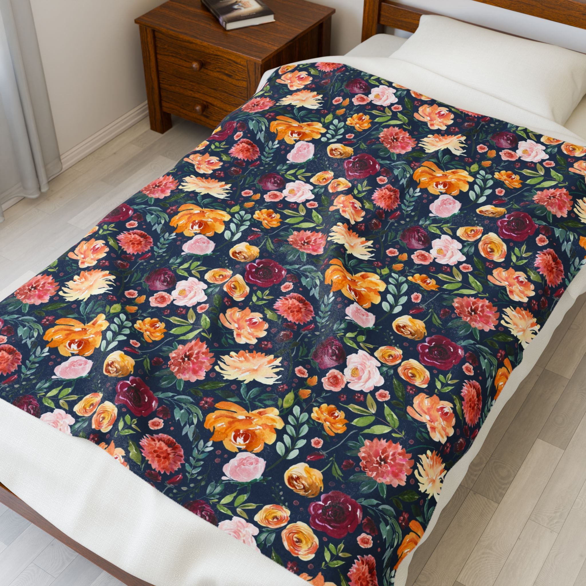 Floral patterned comforter on a bed in a bedroom setting