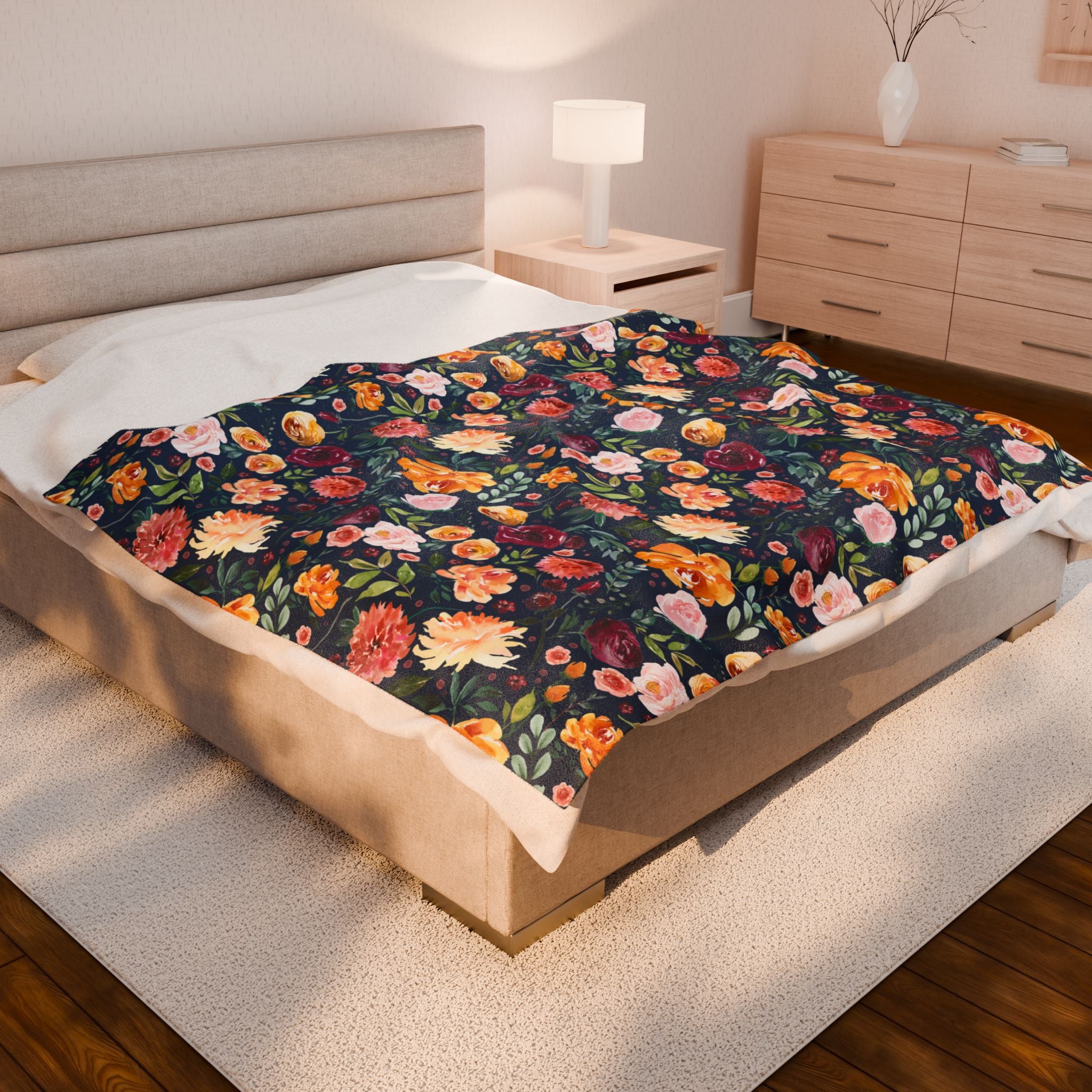 Floral patterned blanket on a bed in a bedroom setting. watercolor flower blanket