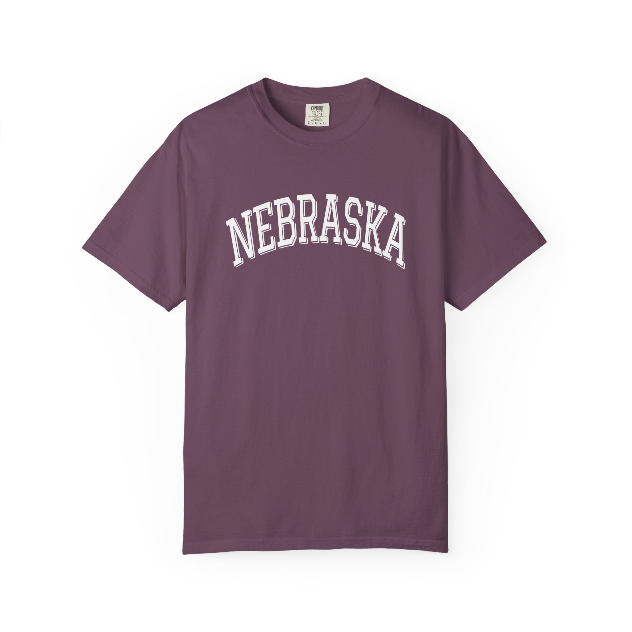 Comfort Colors Berry t-shirt with 'NEBRASKA' printed on it against a white background