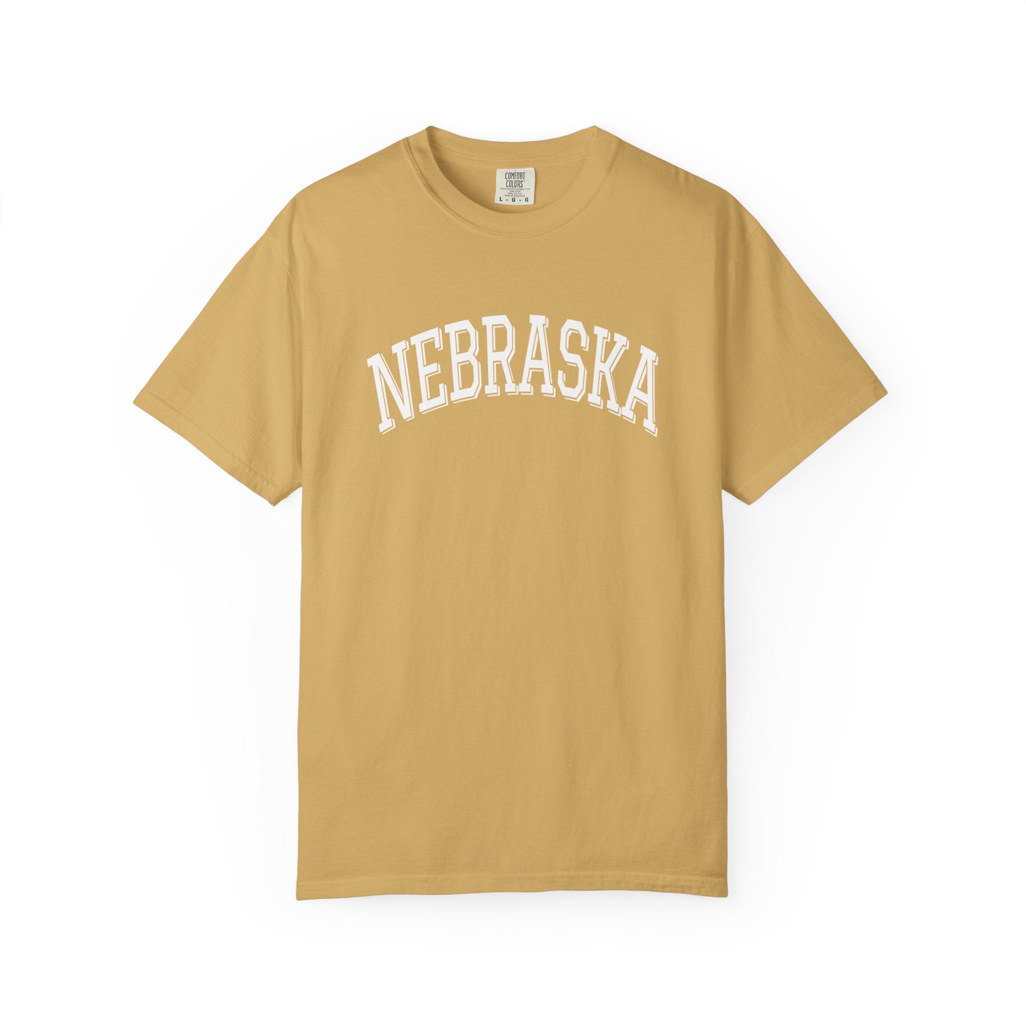 Mustard t-shirt with 'NEBRASKA' printed on it against a white background