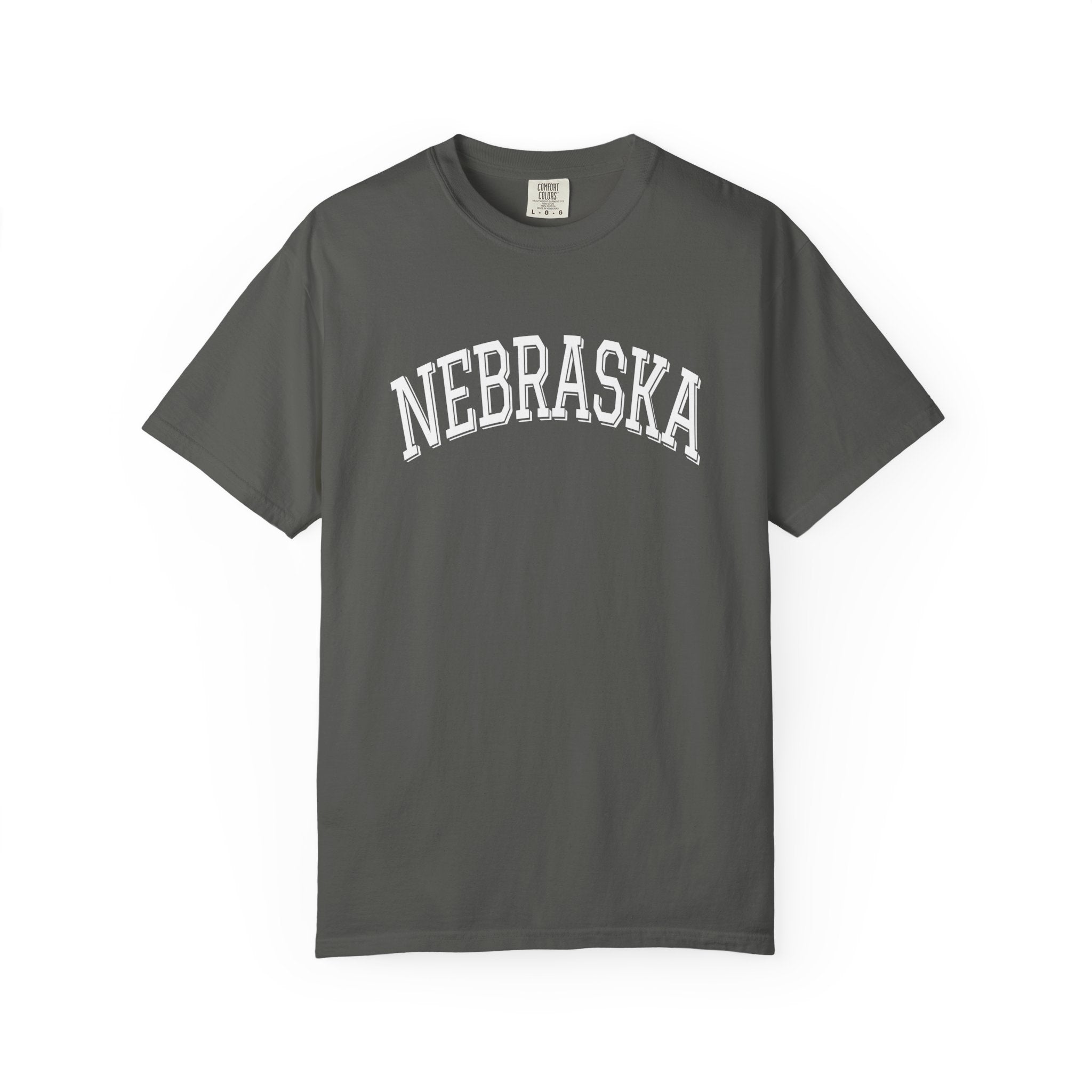 Pepper gray Comfort Colors t-shirt with 'NEBRASKA' printed on it against a white background