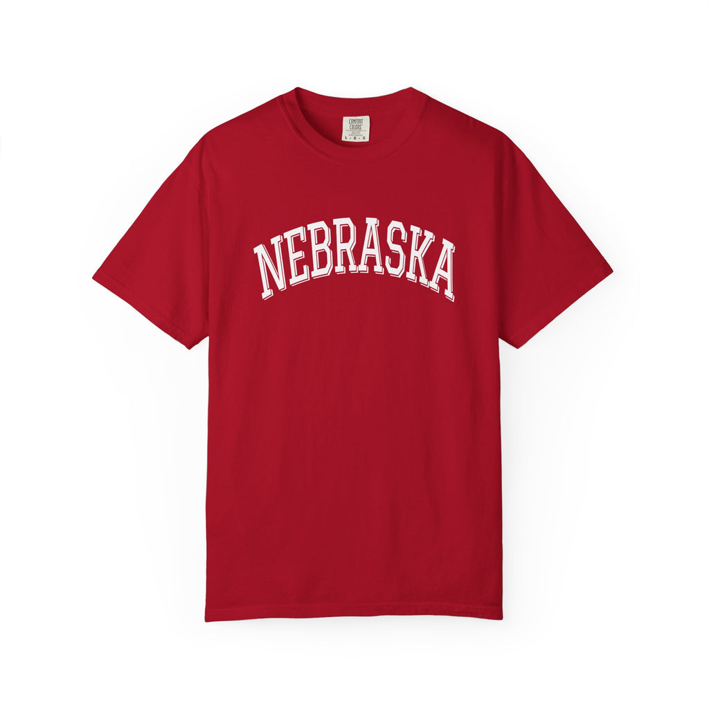 Red t-shirt with 'NEBRASKA' printed on it against a white background
