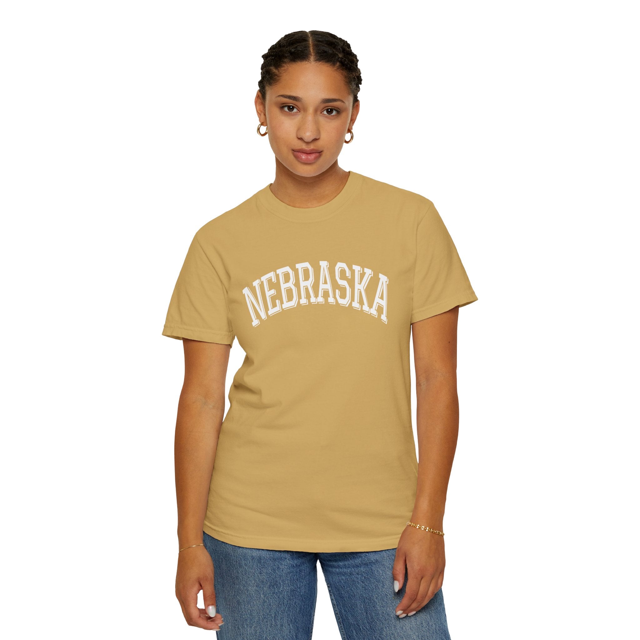 Girl wearing Nebraska unisex t-shirt with classic state lettering
