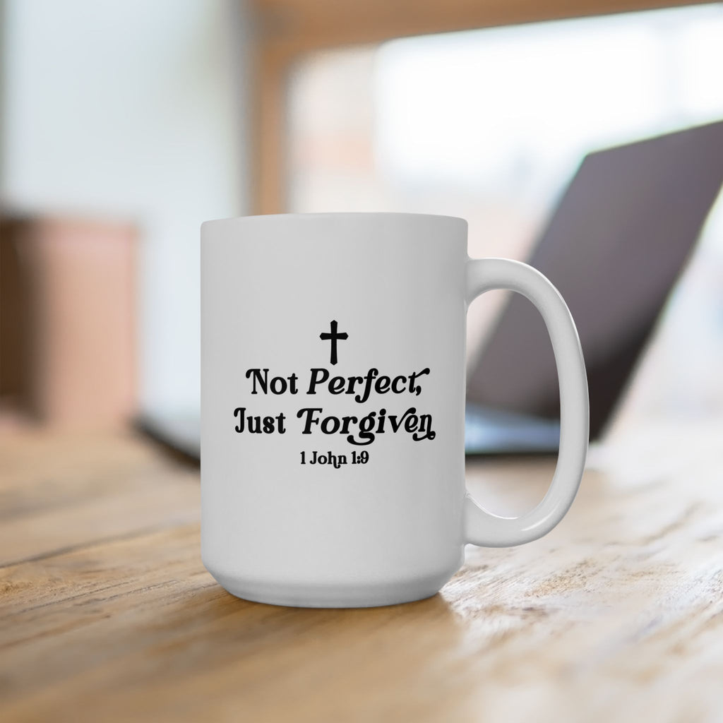 White Christian motivation mug with black text and cross on a wooden surface