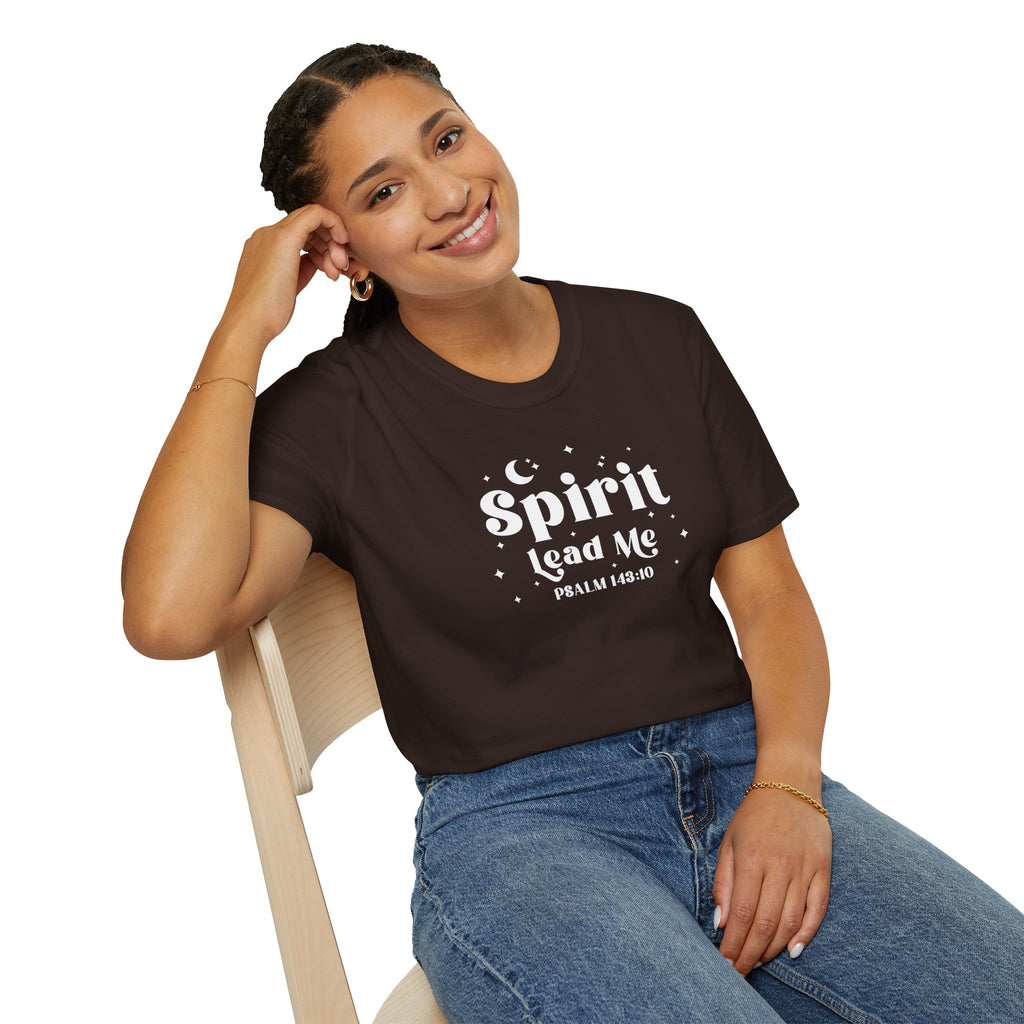 Woman wearing a dark chocolate brown t-shirt with 'Spirit Lead Me' text, sitting on a chair.