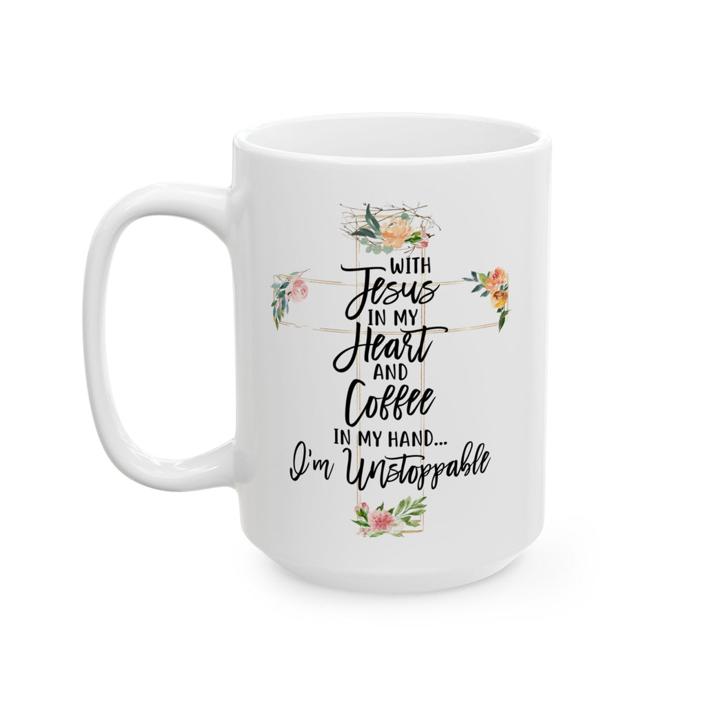 White ceramic Christian coffee mug with floral cross design and quote “With Jesus in my heart and coffee in my hand, I’m unstoppable.”